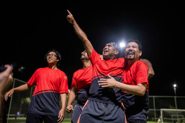 istock Soccer Players Celebrating a Goal Together 2200056221