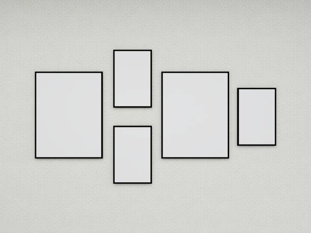 istock Mockup of five blank vertical frames on a white wall 2200056666