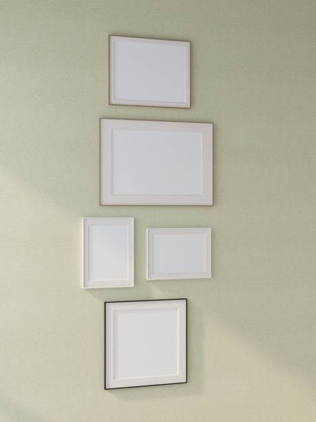 istock Mockup of several frames on a green wall with vertical image orientation 2200057392