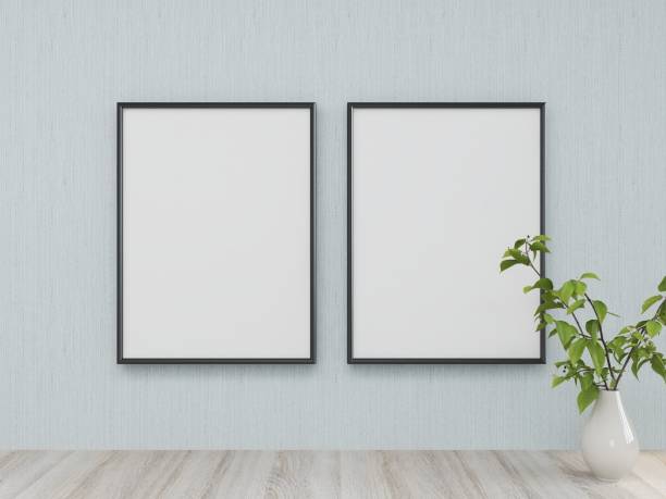 istock Mockup of two vertical frames on a light blue wall and interior decoration with a plant on a table 2200057850