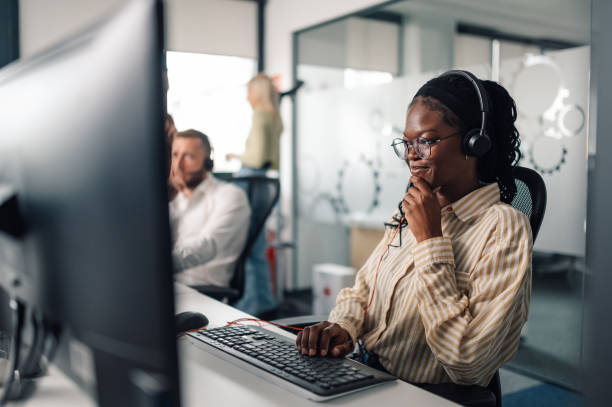 istock Customer service representative working in busy call center office 2200058550