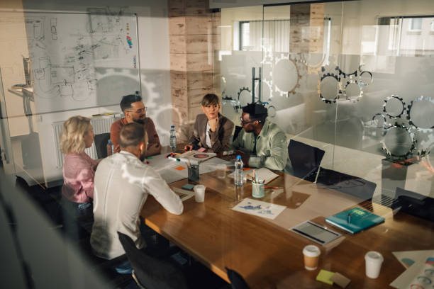 istock Business team discussing strategy during meeting in modern office 2200058617