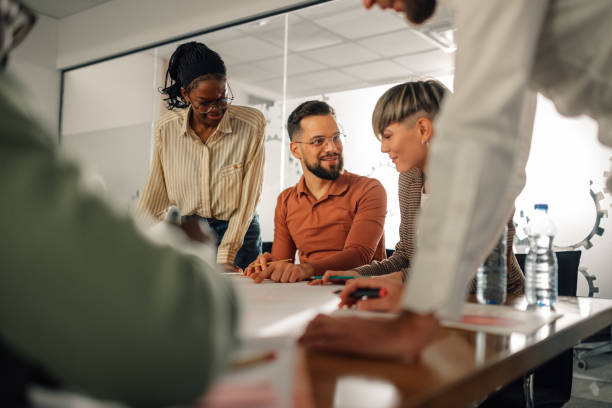 istock Business team collaborating on project during meeting in modern office 2200058624