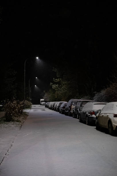istock Snow-Covered Parked Cars on a Quiet Winter Night 2200060791