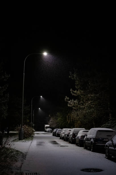 istock Snow-Covered Parked Cars on a Quiet Winter Night 2200060814