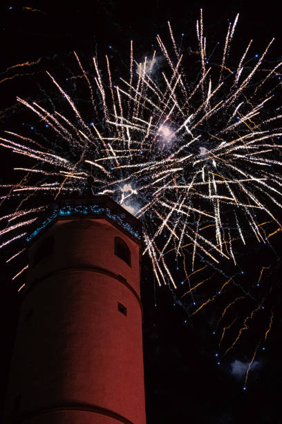 istock Fireworks bursting over historic tower at night 2200060900