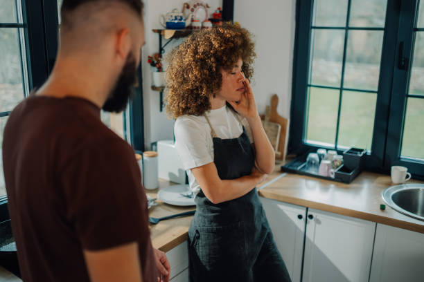 istock Young couple having a disagreement while cooking in kitchen 2200061783
