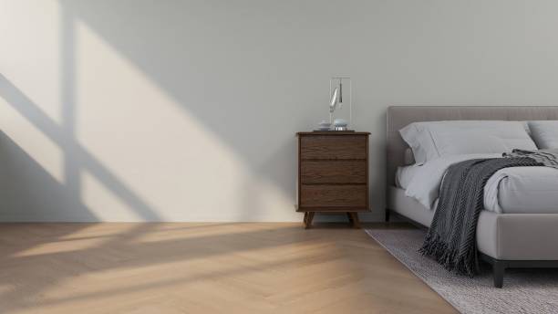istock Wall mockup in a bedroom with a modern bed, nightstand and table decorations, horizontal image orientation 2200062575