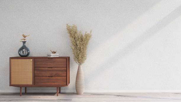 istock White wall mockup with sideboard, table decorations and ornamental plant, horizontal image orientation 2200063004