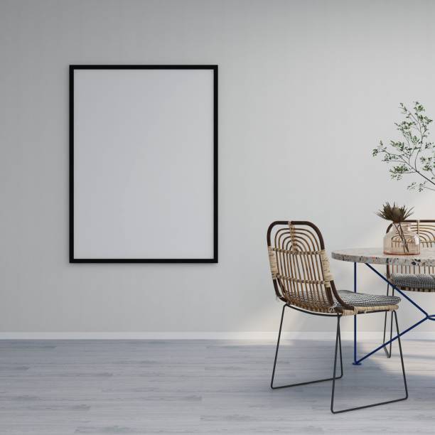 istock Vertical frame mockup on white wall, dining table and chairs on the side with ornaments 2200063114