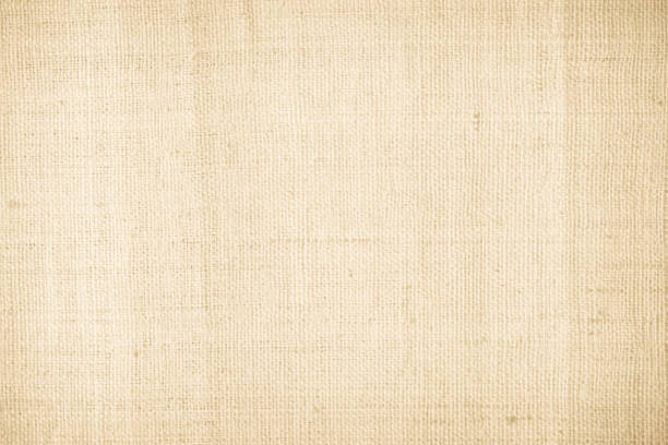 istock Brown sackcloth woven texture background in natural pattern. Jute hessian burlap, linen background in light beige cream color blank. Weaving canvas fiber line cotton cloth textured as organic. 2200064337