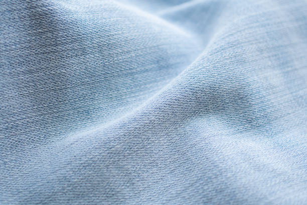 istock Old denim blue jeans fabric texture background close up 2200064409