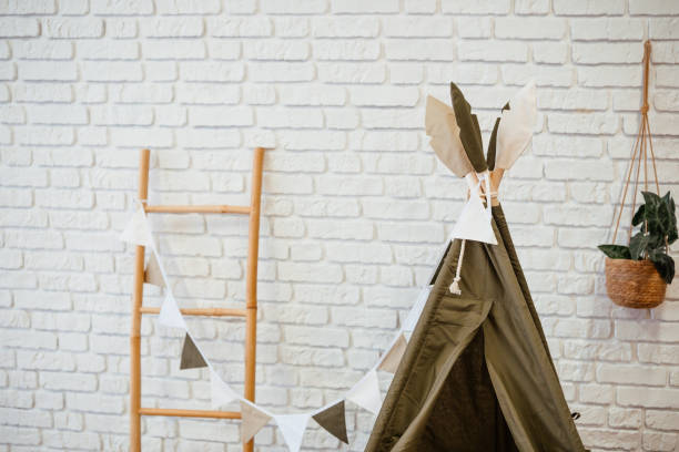 istock Cozy indoor play area with a tent and decorative elements in a simple setting 2200065857