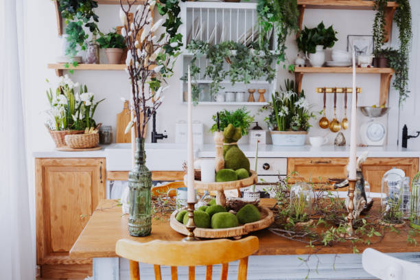 Rustic kitchen with natural decor featuring plants and candles for ambiance