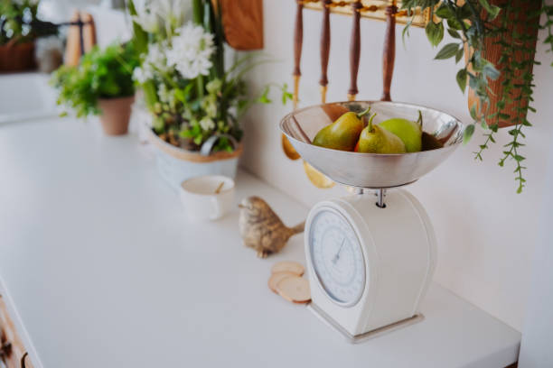 istock Modern kitchen with fresh pears and plants on a bright countertop 2200066106
