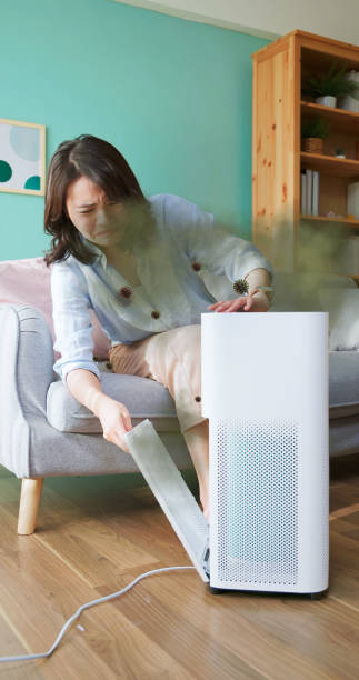 istock woman check dirty air purifier 2200066519