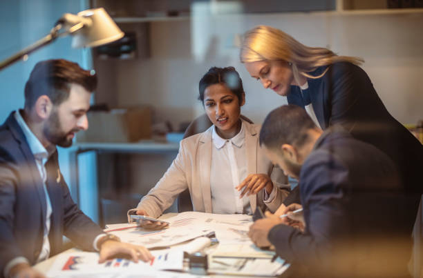 istock Diverse Team of Business Executives in Strategy Session 2200067103