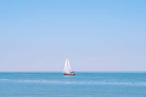 istock Sailboat navigating Across the Open Sea on a Summer Day 2200070931