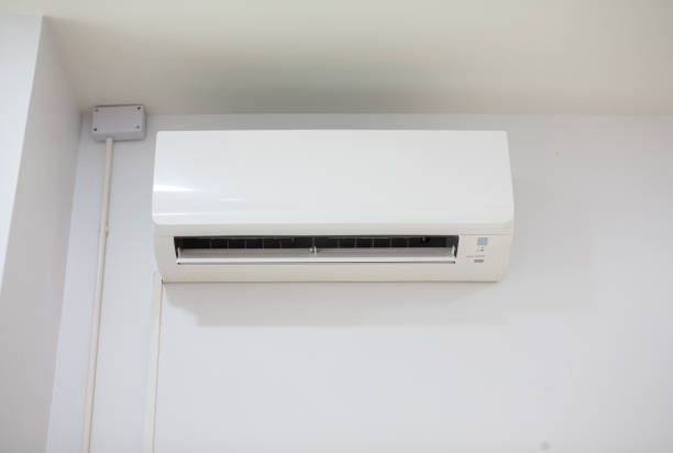 istock White air conditioner installed in a white room. 2200074435
