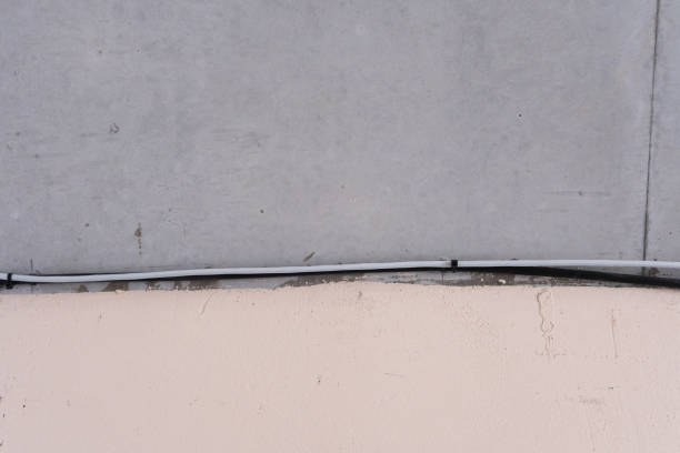 Concrete surface with visible crack and mismatch alignment in urban area