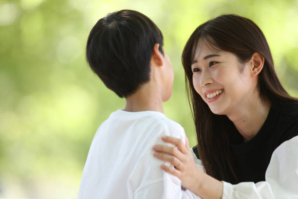 istock Smiling parents and children 2200078928