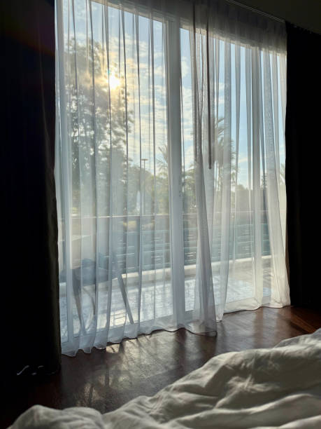 istock Peaceful Morning Behind a Sheer Curtain 2200082878