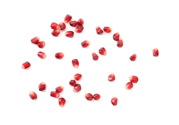 istock Ripe juicy pomegranate grains isolated on white, top view 2200085016