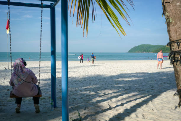 Langkawi, Malaysia - January 5, 2025: The Pantai Cenang beach, the most popular beach spots in Langkawi.