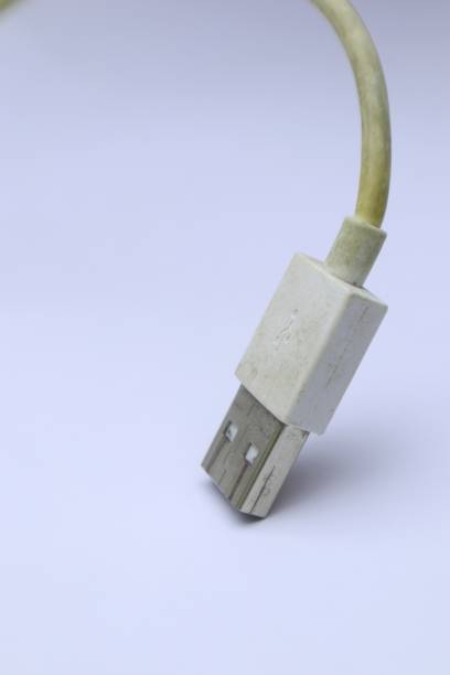 istock Close-up of a Used and Yellowed USB Connector on a Clean White Surface 2200089377