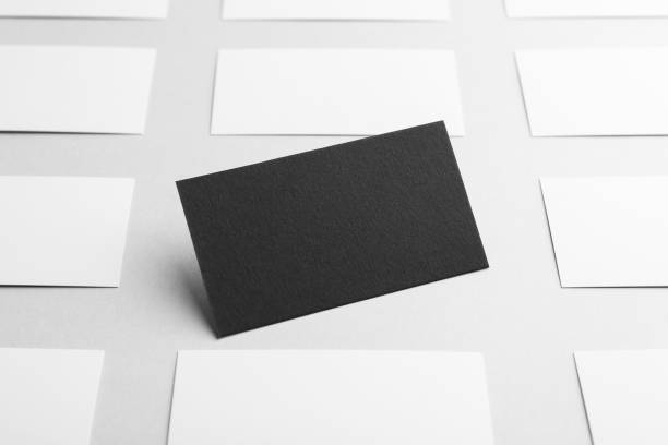 istock Blank black and white business cards on light background. Mockup for design 2200092522