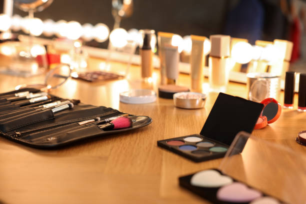 istock Different makeup products and brushes on wooden table indoors 2200093235
