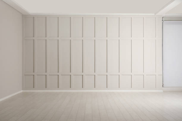 istock Empty room with beige walls and laminated flooring 2200095164