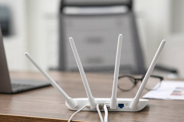 istock Modern Wi-Fi router on wooden table indoors 2200095167