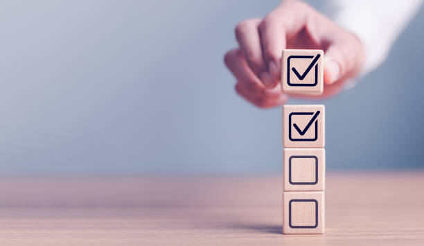 istock Checklist concept, business person checklist tick answer sign in checkbox, validation online questionnaire quality control document, man use pen to tick correct sign mark in checkbox form. 2200097358