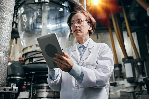 istock Proud female engineer with tablet working at the factory 2200097645
