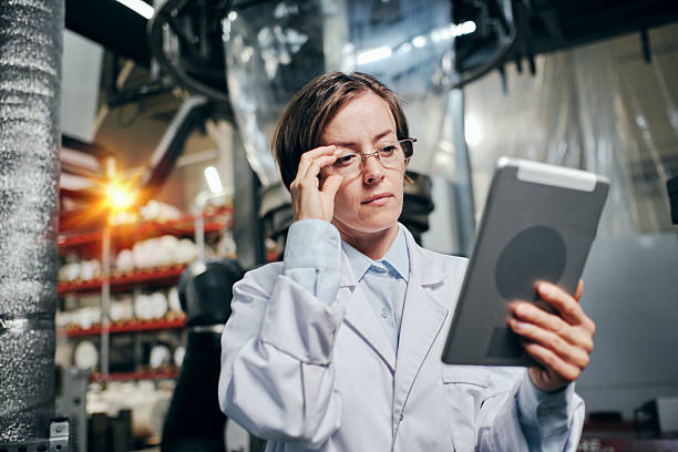 istock Female engineer with tablet working at the factory 2200097670