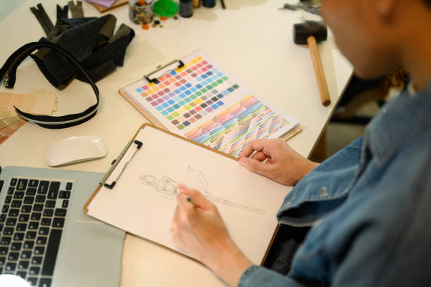 istock Creative fashion designer sketching a clothing design on paper while working at studio 2200098058