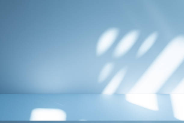 istock Studio style background wall decoration presentation uses white and blue tones. with shadows cast from a nearby window, concept creating a decorative 2200098582
