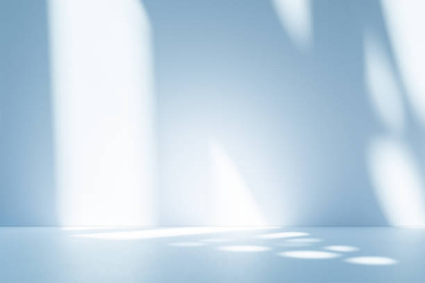 istock Studio style background wall decoration presentation uses white and blue tones. with shadows cast from a nearby window, concept creating a decorative 2200098599