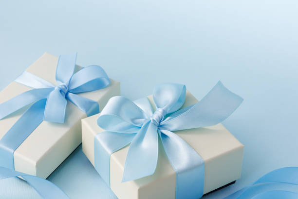 istock Image of a gift tied with a light blue ribbon 2200103951