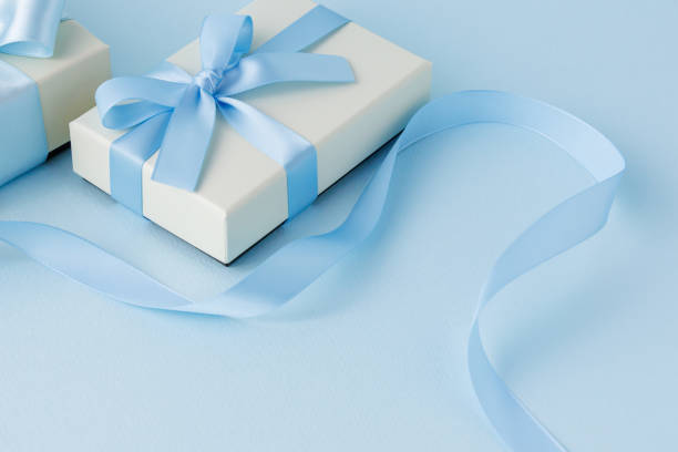 istock Image of a gift tied with a light blue ribbon 2200103964