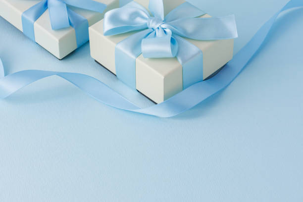 istock Image of a gift tied with a light blue ribbon 2200104018