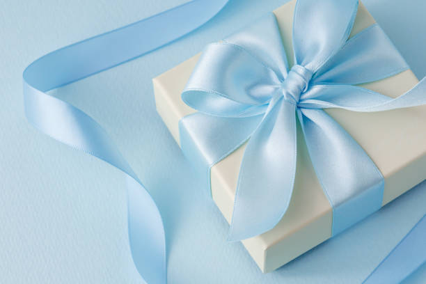 istock Image of a gift tied with a light blue ribbon 2200104061