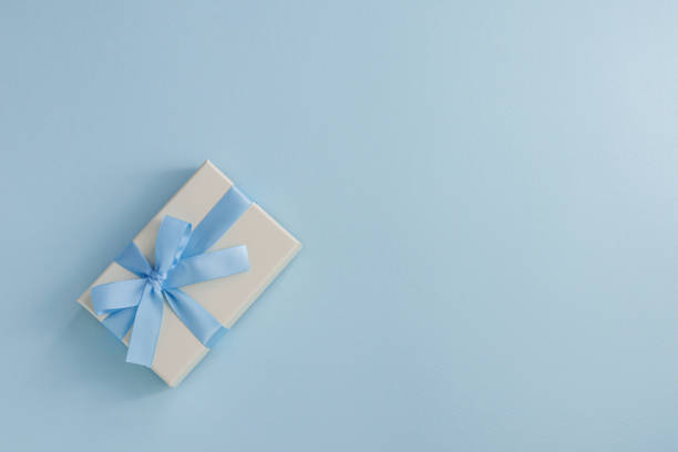 istock Image of a gift tied with a light blue ribbon 2200104184