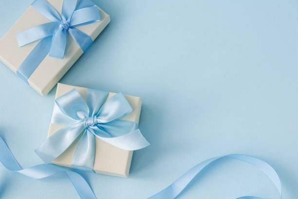 istock Image of a gift tied with a light blue ribbon 2200104202