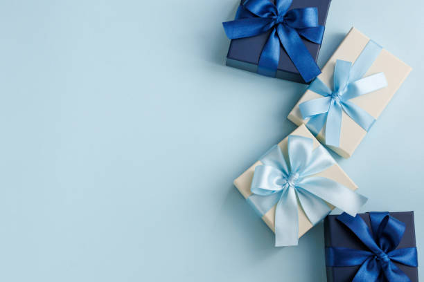 istock Image of a gift tied with a light blue ribbon 2200104289