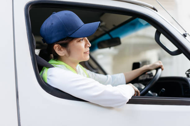 istock Asian female manual worker driving delivery van 2200113914