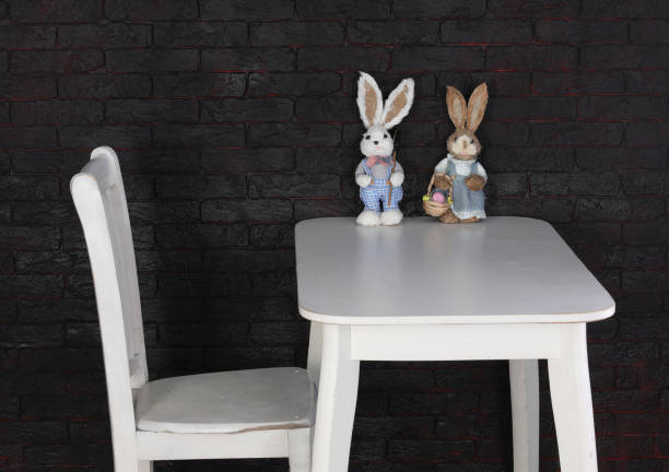 interior white table with decorations and white chair in black room