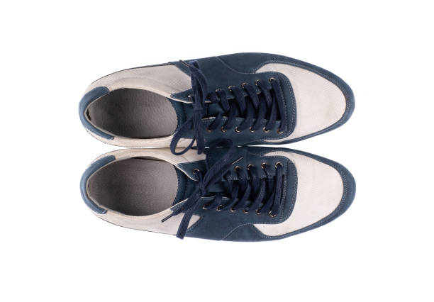 istock white blue worn sports shoes isolated on white background 2200116708