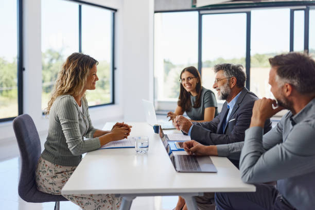 istock Happy human resource team talking to a candidate on a job interview. 2200122303